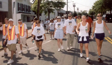 a group of people walking down a street