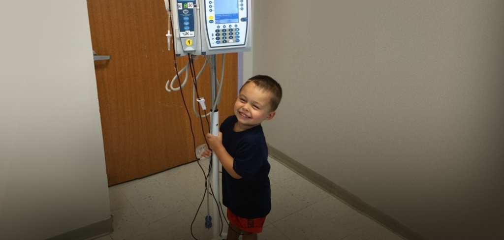 a child smiling at a medical device